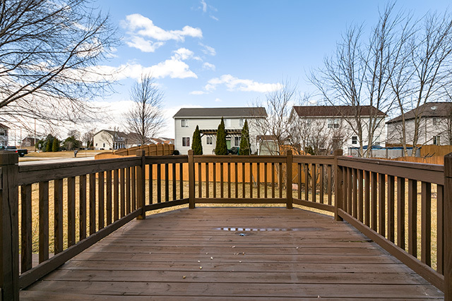 24340 Hemlock Drive Plainfield, IL 60585 - Photo 29 of 33 a view of a house with a wooden fence
