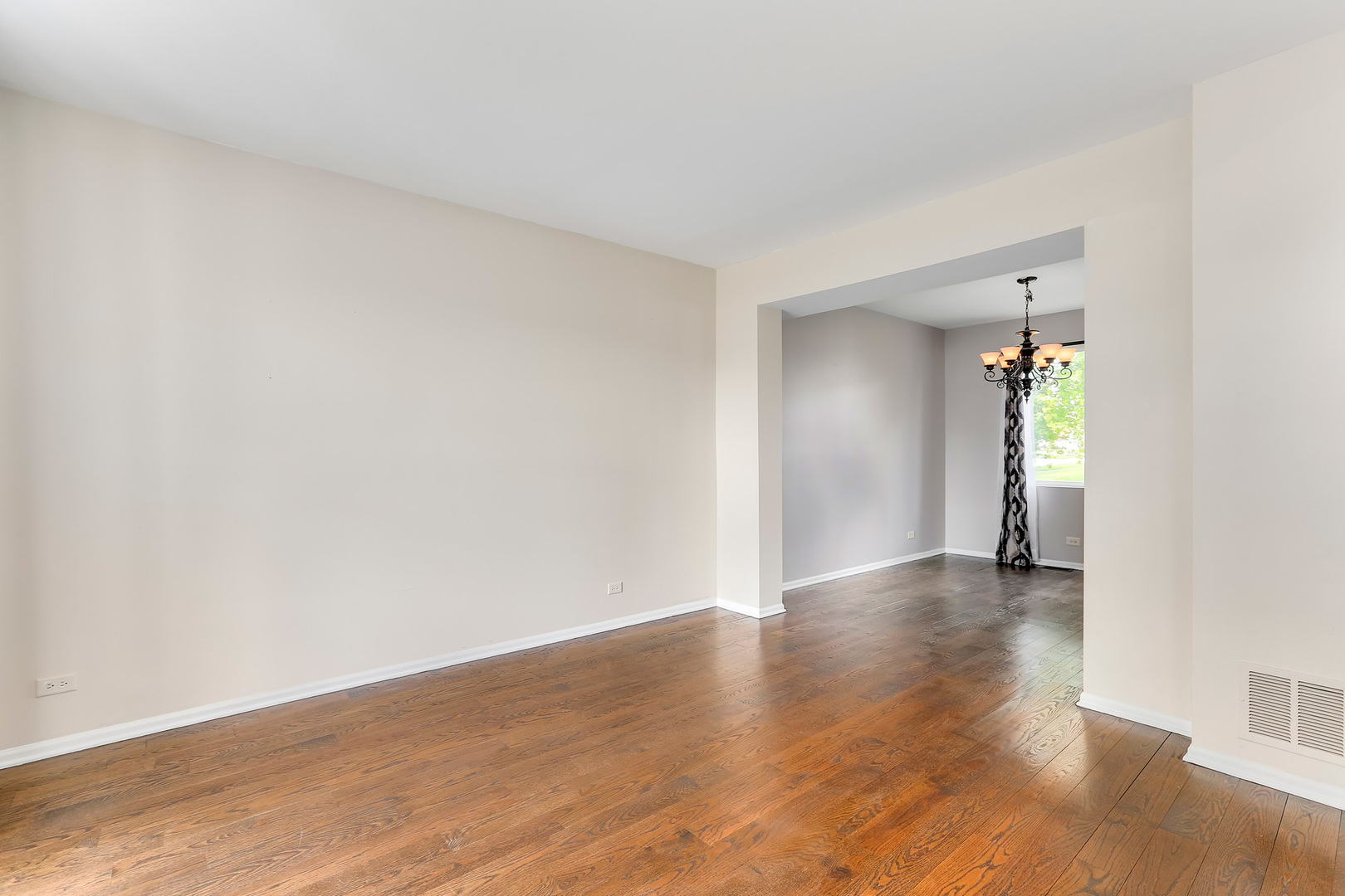 24340 Hemlock Drive Plainfield, IL 60585 - Photo 4 of 33 a view of an empty room with wooden floor