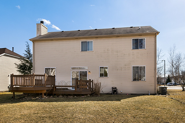 24340 Hemlock Drive Plainfield, IL 60585 - Photo 32 of 33 a front view of a house with a yard
