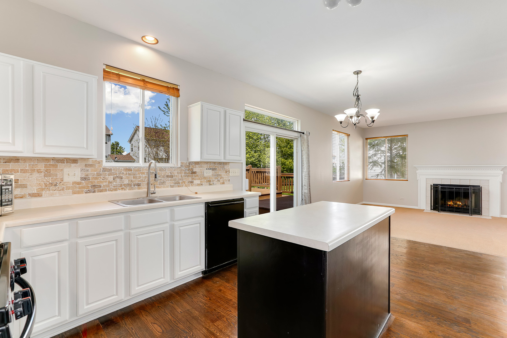 24340 Hemlock Drive Plainfield, IL 60585 - Photo 6 of 33 a kitchen with stainless steel appliances granite countertop a sink stove and refrigerator