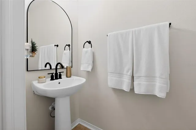 a bathroom with a sink and mirror