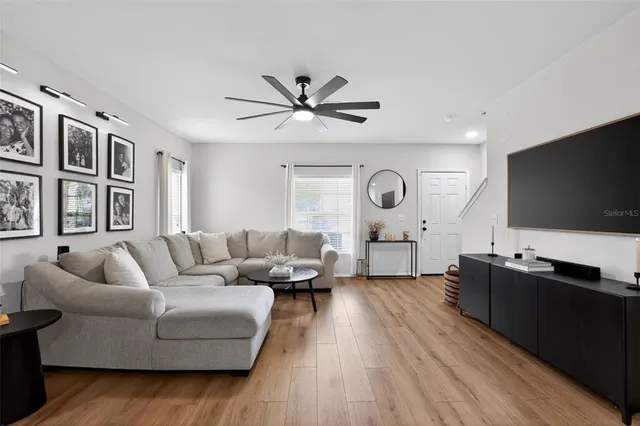 a living room with furniture and a flat screen tv