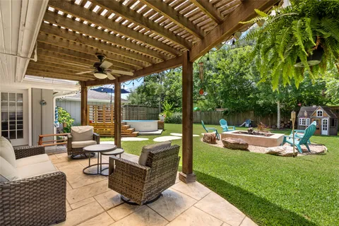 a view of a backyard with sitting area