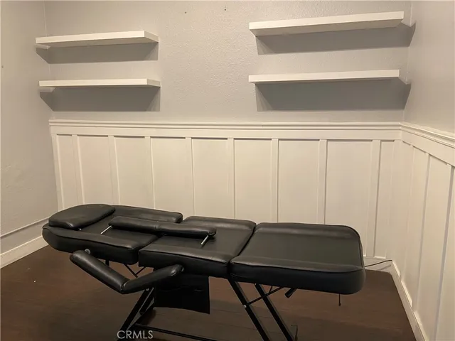 a backyard of a house with table and chair