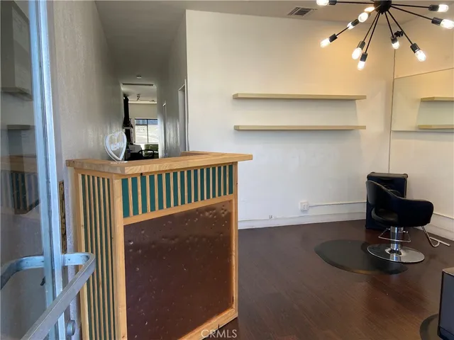 a view of a hallway with seating area