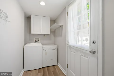a view of storage and utility room with washer and dryer