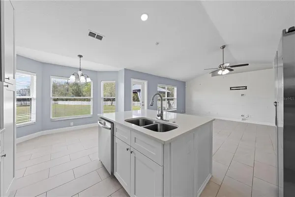 a kitchen that has a sink and cabinets