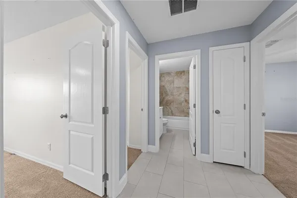 a view of a bathroom with a glass door shower