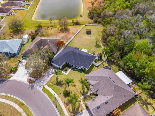 an aerial view of a house with a swimming pool