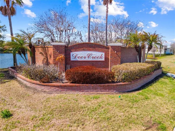 a view of a swimming pool with an outdoor seating and a yard