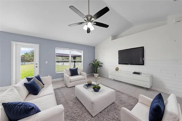 a living room with furniture and a flat screen tv