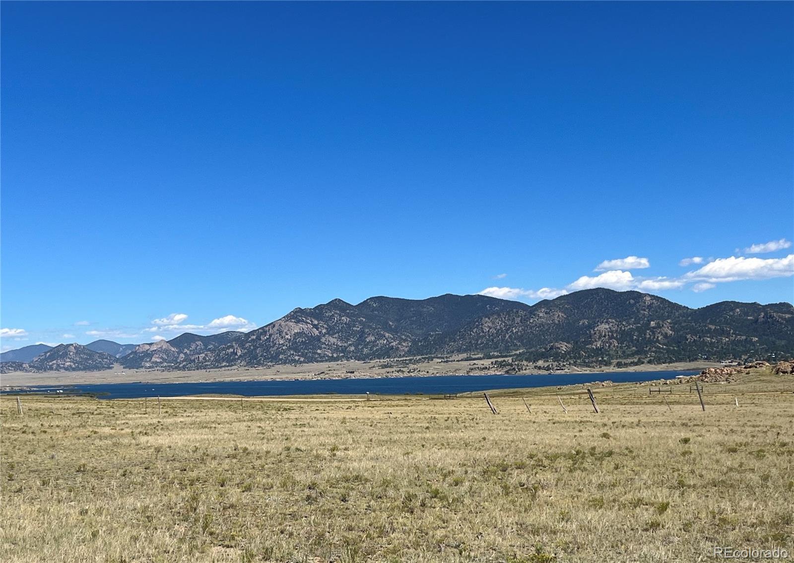 a view of an ocean and a mountain