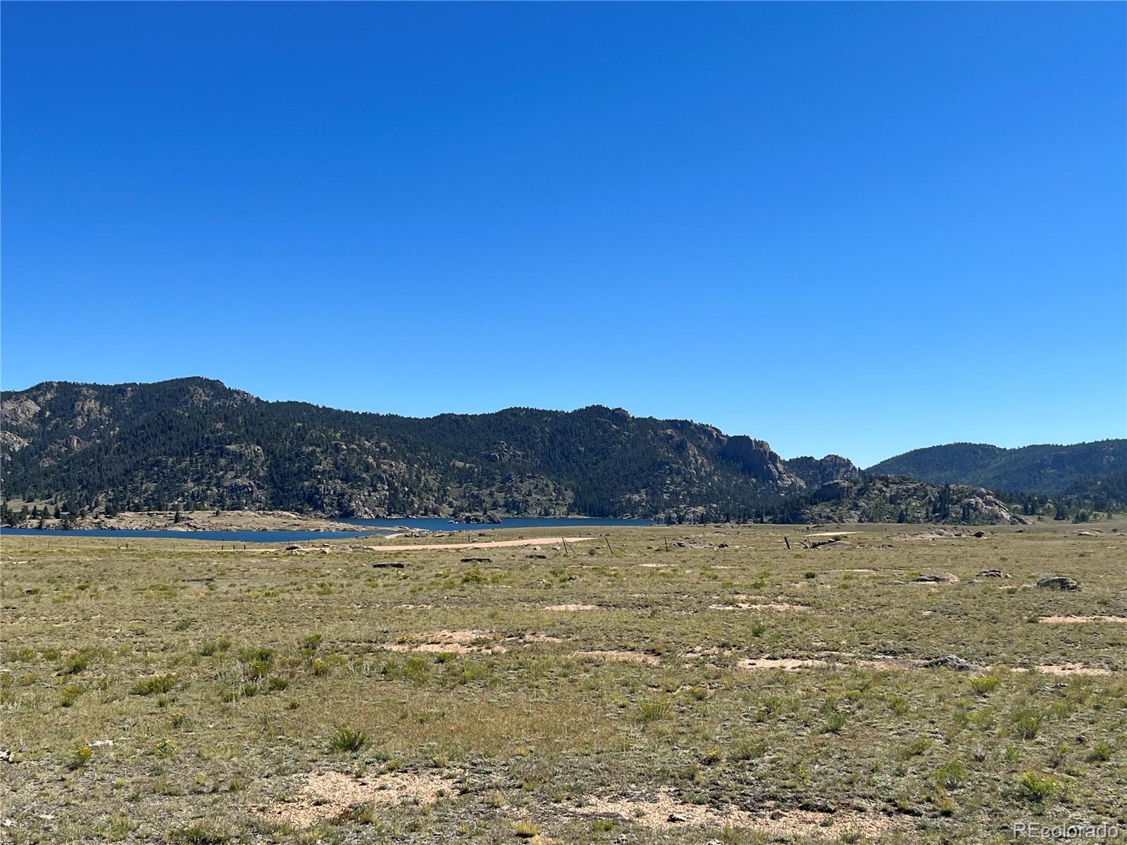 Ken Road Florissant, CO 80816 - Photo 13 of 16 a view of a lake with mountains in the background