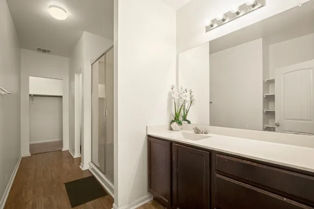 a bathroom with a sink and a mirror