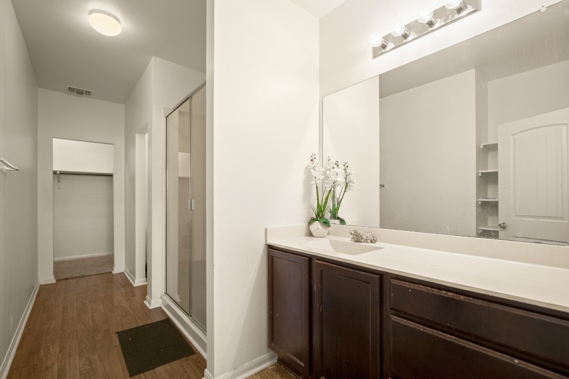14504 Callan Court Manor, TX 78653 - Photo 12 of 22 a bathroom with a sink and a mirror