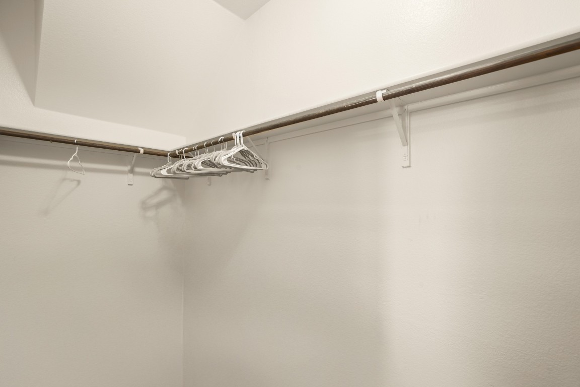 14504 Callan Court Manor, TX 78653 - Photo 13 of 22 a view of a room with racks on the wall