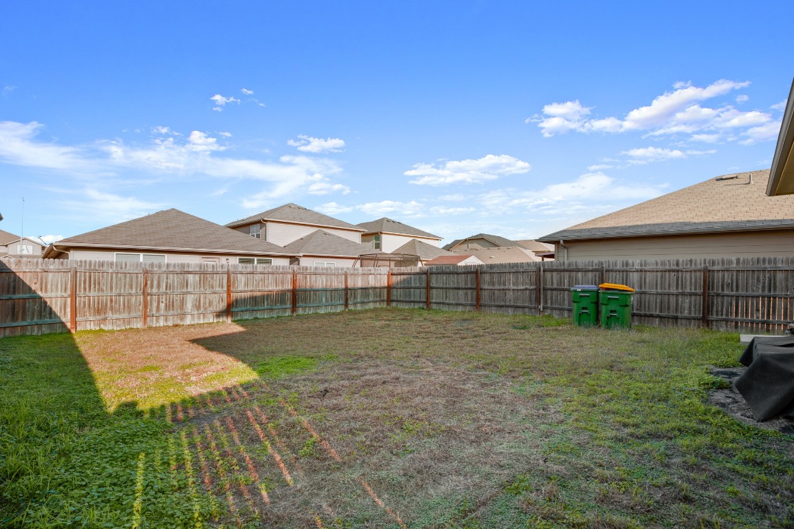 14504 Callan Court Manor, TX 78653 - Photo 21 of 22 a view of a house with a yard