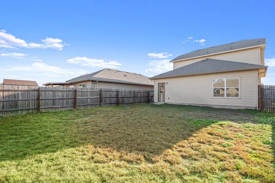 14504 Callan Court Manor, TX 78653 - Photo 22 of 22 a wooden building with a yard