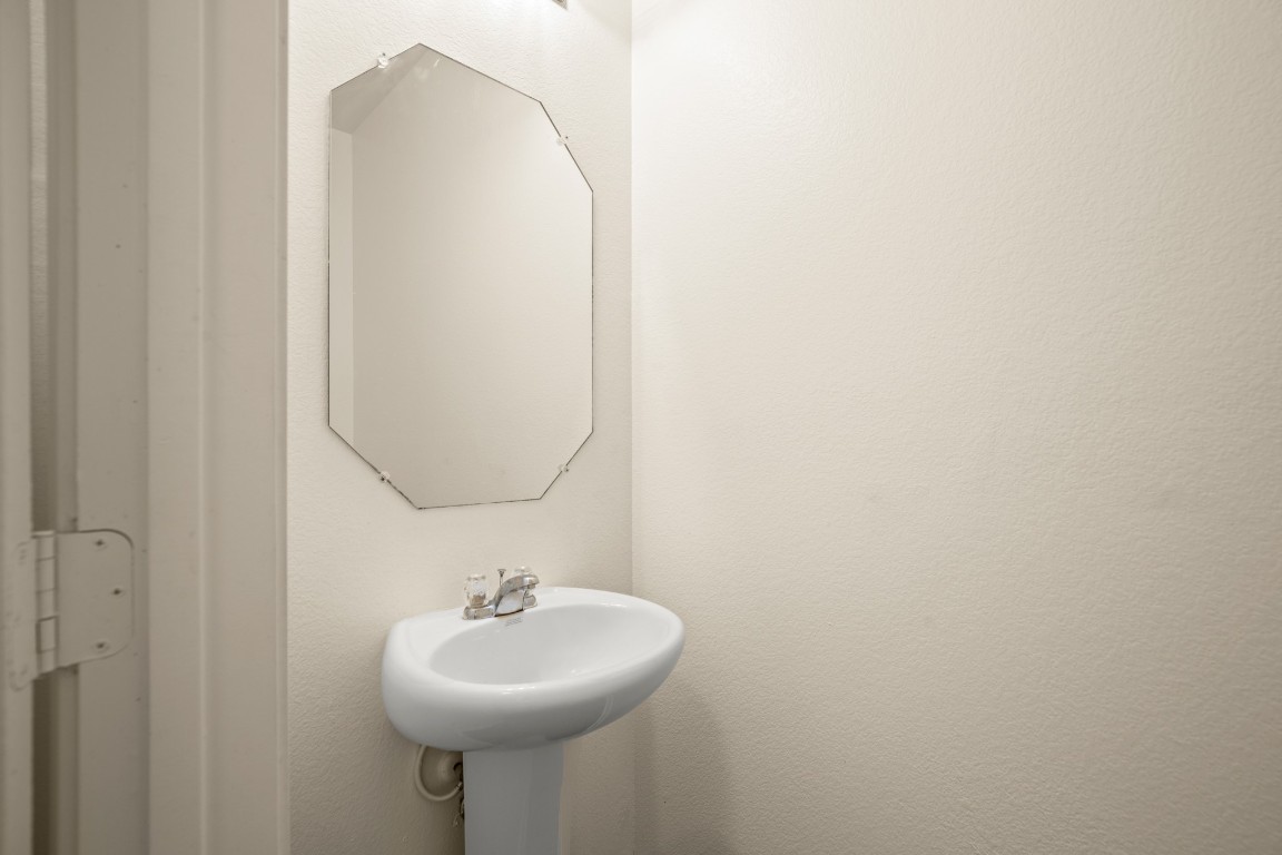 14504 Callan Court Manor, TX 78653 - Photo 9 of 22 a bathroom with a sink and a mirror