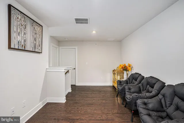 a living room with furniture and a rug