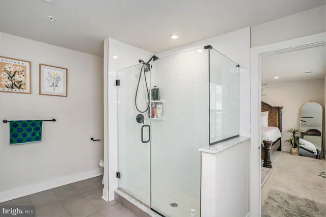 a bathroom with a shower and a sink