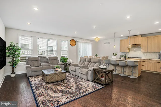 a living room with lots of furniture and a rug
