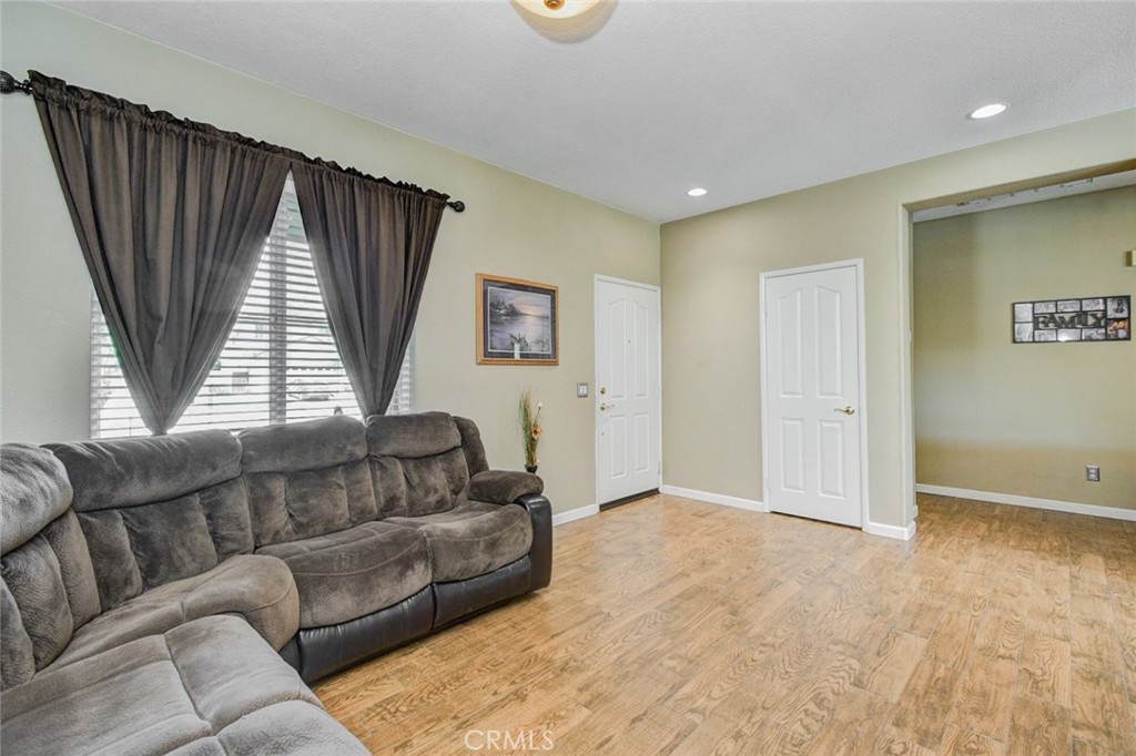 6174 Risingstar Drive Eastvale, CA 92880 - Photo 17 of 57 a living room with furniture and a window