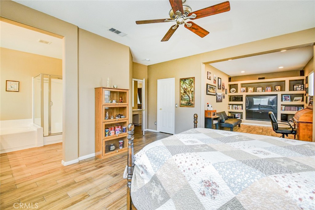 6174 Risingstar Drive Eastvale, CA 92880 - Photo 26 of 57 a bedroom with a bed and a cabinets