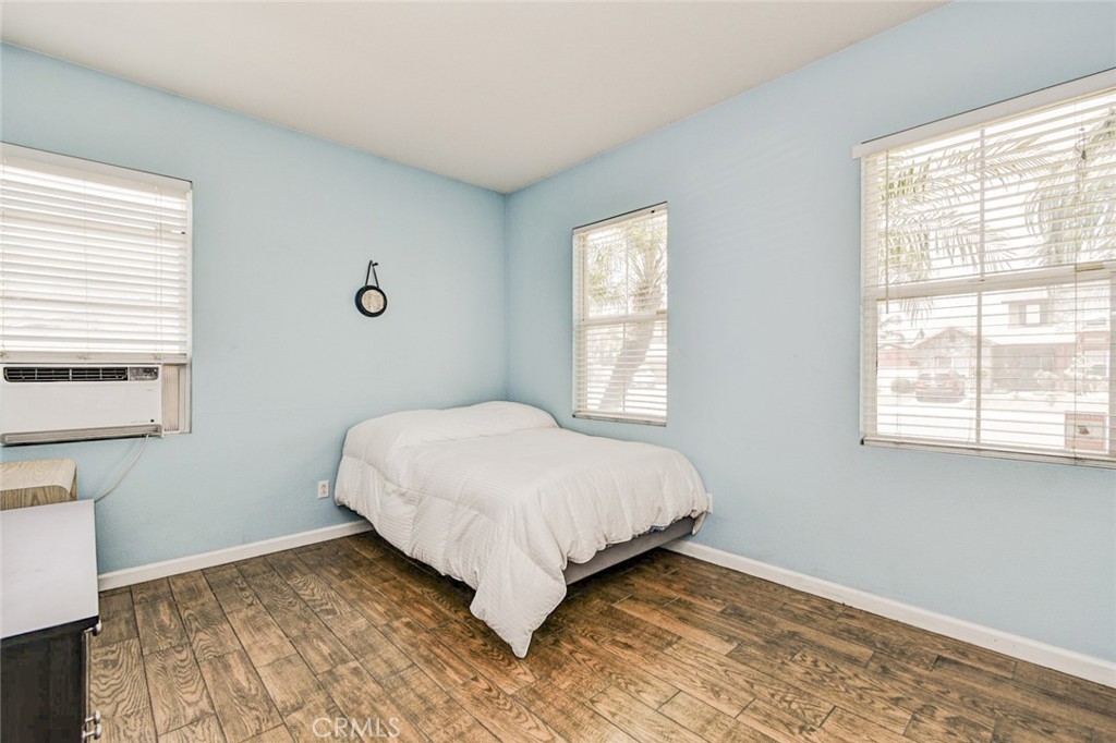 6174 Risingstar Drive Eastvale, CA 92880 - Photo 33 of 57 a bedroom with a bed and a window