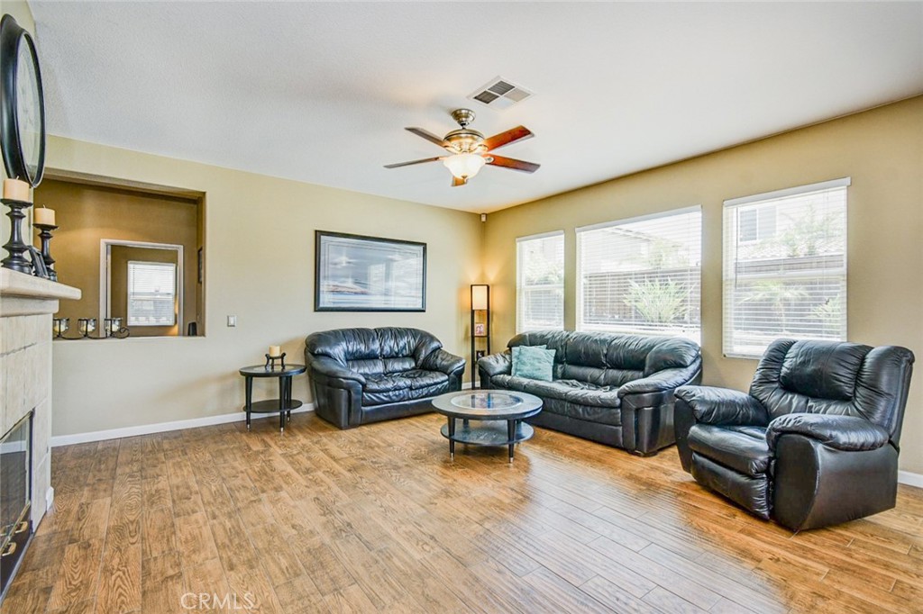6174 Risingstar Drive Eastvale, CA 92880 - Photo 5 of 57 a living room with furniture and a large window