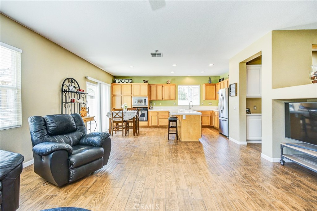 6174 Risingstar Drive Eastvale, CA 92880 - Photo 6 of 57 a living room with furniture and a table