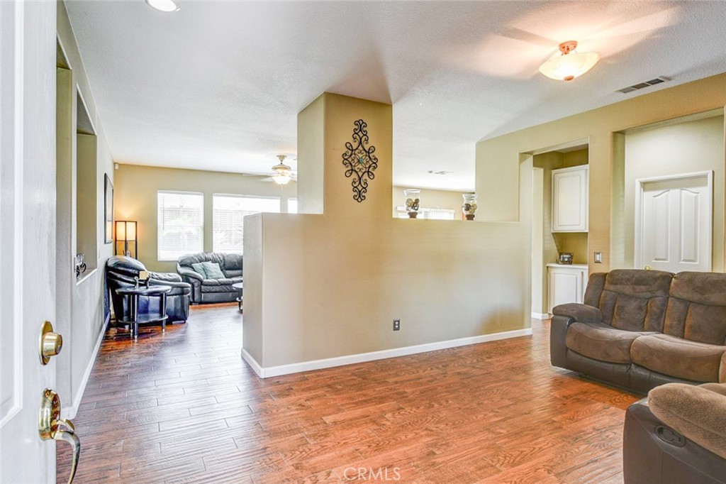 6174 Risingstar Drive Eastvale, CA 92880 - Photo 8 of 57 a living room with furniture and a table