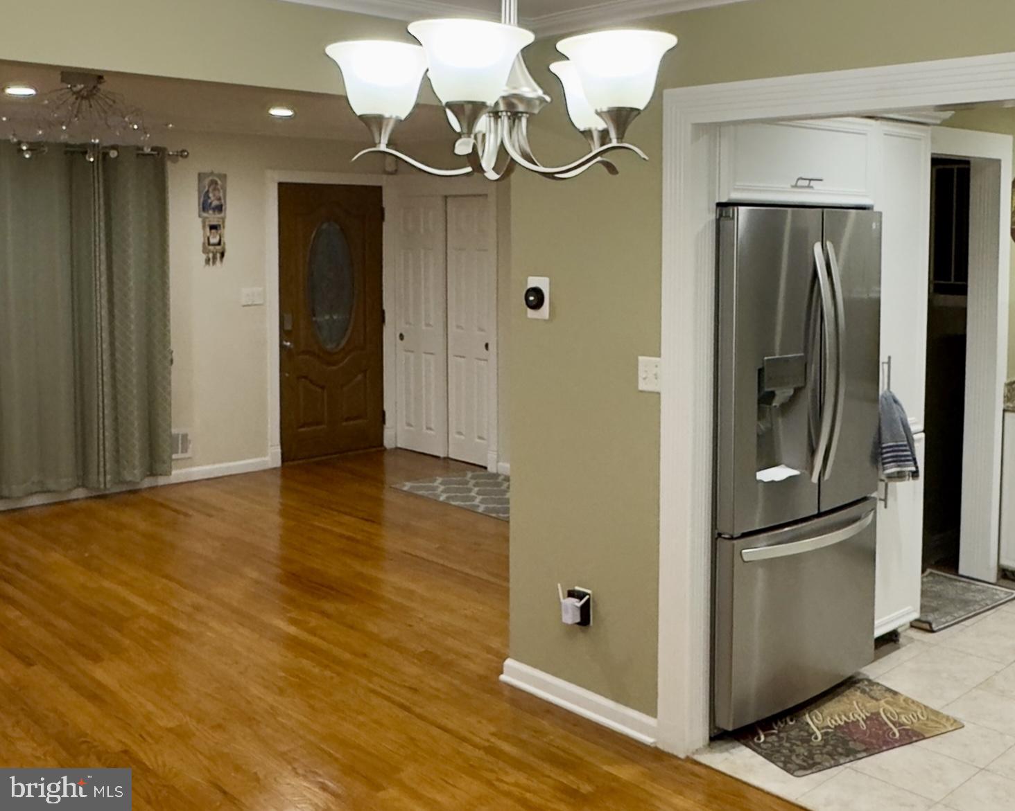 858 Estates Boulevard Hamilton, NJ 08690 - Photo 4 of 10 a view of a kitchen with a refrigerator and wooden floor