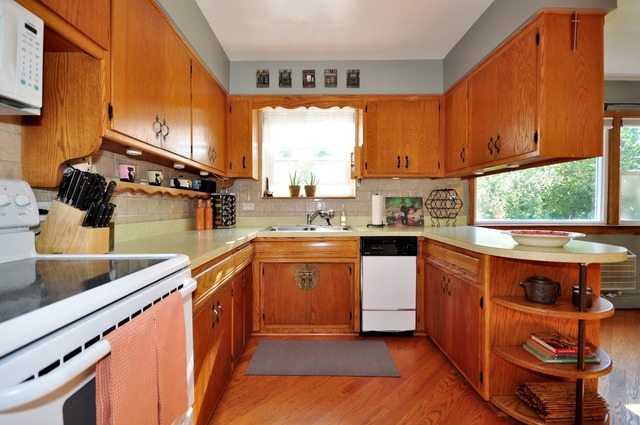 50 West Avenue, Unit 2N Riverside, IL 60546 - Photo 11 of 18 a kitchen with stainless steel appliances granite countertop a sink a stove and a refrigerator