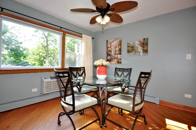 50 West Avenue, Unit 2N Riverside, IL 60546 - Photo 7 of 18 a view of a dining room with furniture window and wooden floor