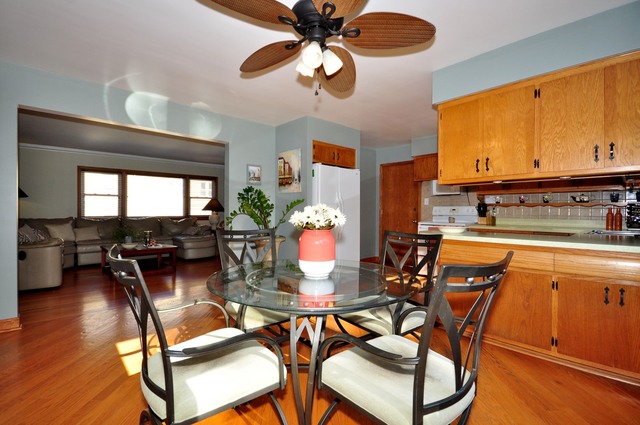 50 West Avenue, Unit 2N Riverside, IL 60546 - Photo 8 of 18 a dining room filled chandelier and wooden floor
