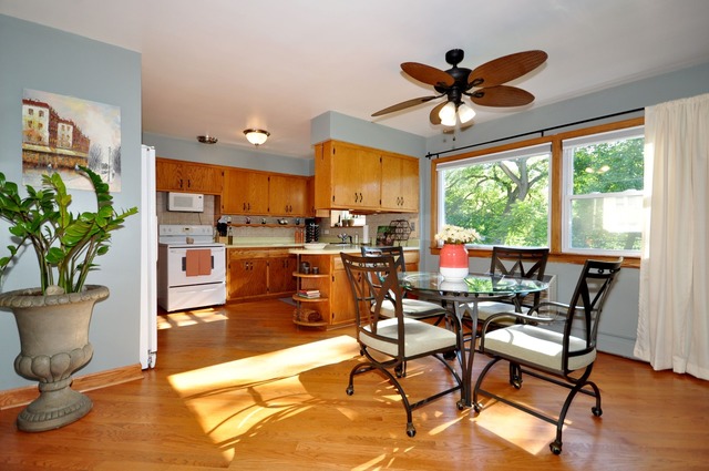 50 West Avenue, Unit 2N Riverside, IL 60546 - Photo 9 of 18 a dining room with furniture window and wooden floor