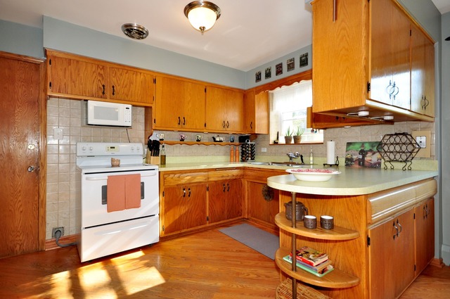 50 West Avenue, Unit 2N Riverside, IL 60546 - Photo 10 of 18 a kitchen with stainless steel appliances a sink and cabinets