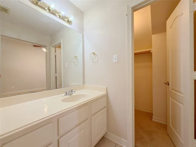 a bathroom with a bathtub shower and toilet
