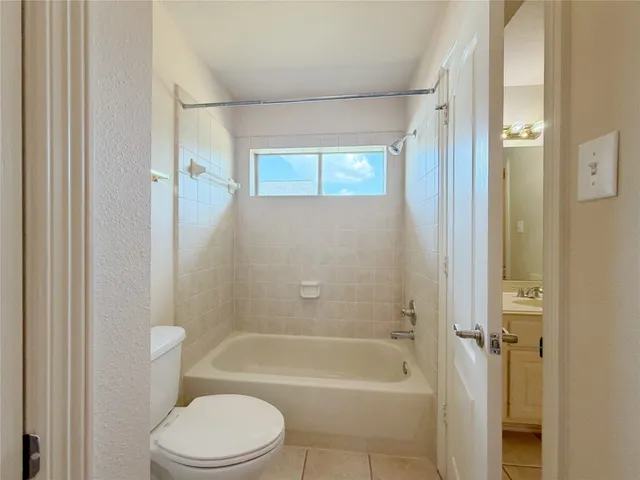 a utility room with sink dryer and washer