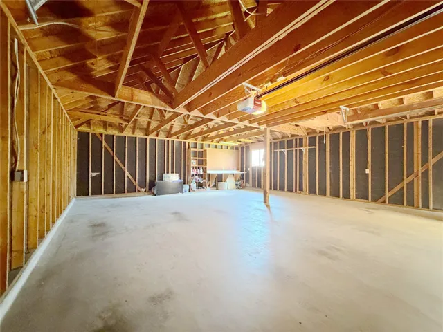 a view of a house with backyard and a garden