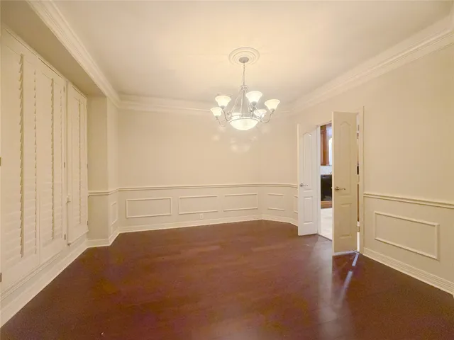 a view of a room with wooden floor