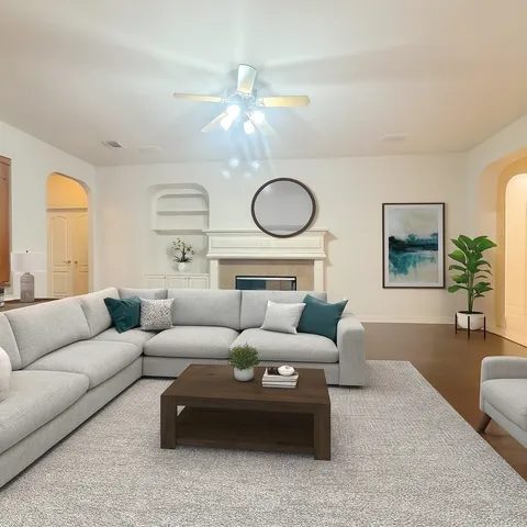 a living room with furniture a lamp and a large window