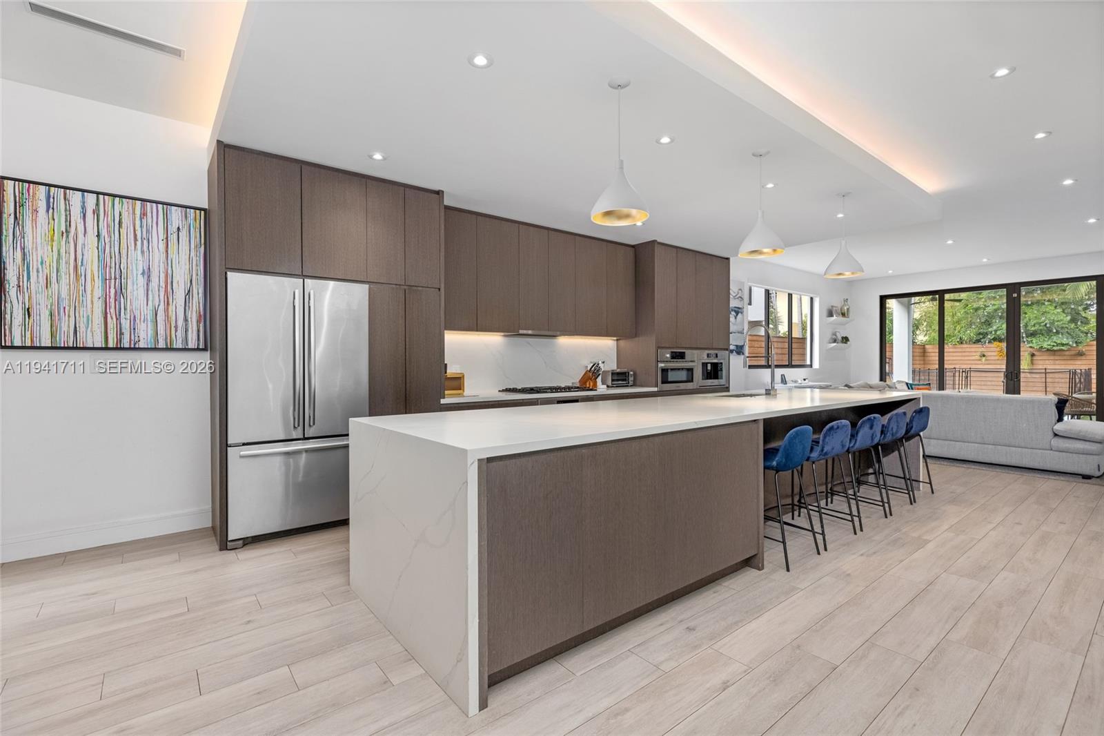 3222 Matilda Street, Unit 3222 Miami, FL 33133 - Photo 14 of 70 a kitchen with refrigerator and cabinets