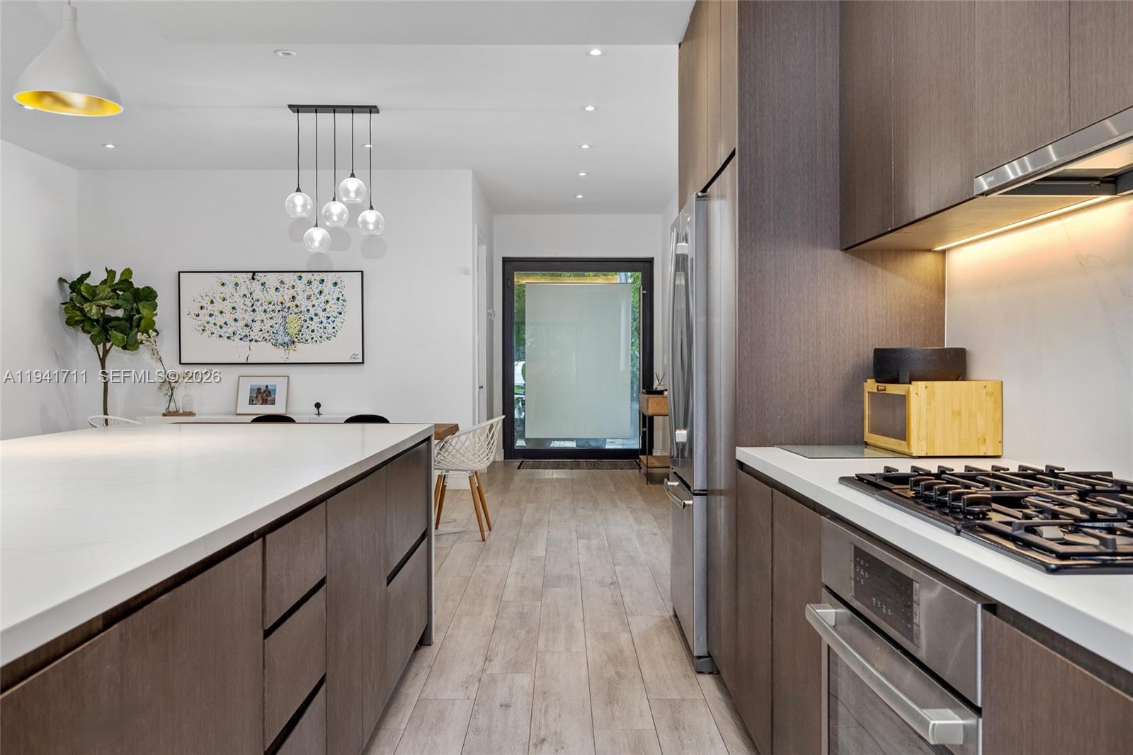 3222 Matilda Street, Unit 3222 Miami, FL 33133 - Photo 15 of 70 a kitchen with counter top space and stove