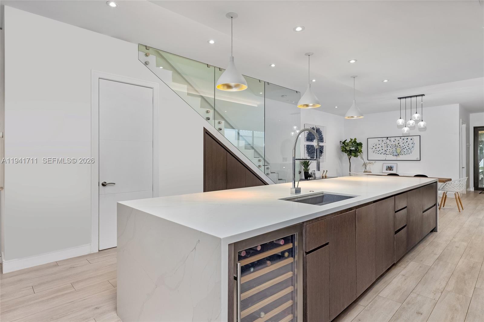 3222 Matilda Street, Unit 3222 Miami, FL 33133 - Photo 16 of 70 a kitchen with stainless steel appliances kitchen island a sink and a refrigerator