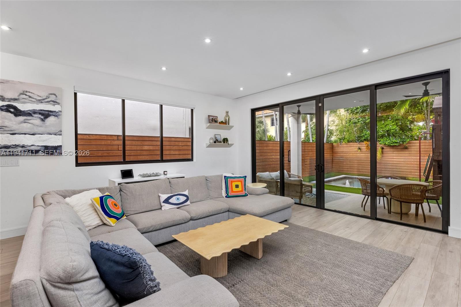 3222 Matilda Street, Unit 3222 Miami, FL 33133 - Photo 19 of 70 a living room with furniture and a flat screen tv