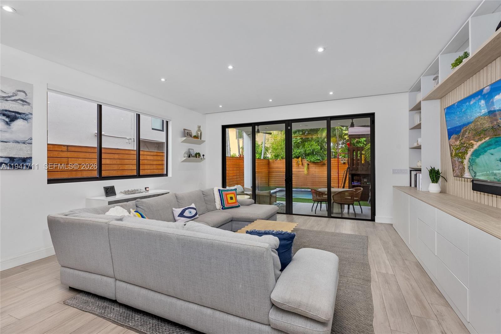 3222 Matilda Street, Unit 3222 Miami, FL 33133 - Photo 20 of 70 a living room with furniture and a flat screen tv