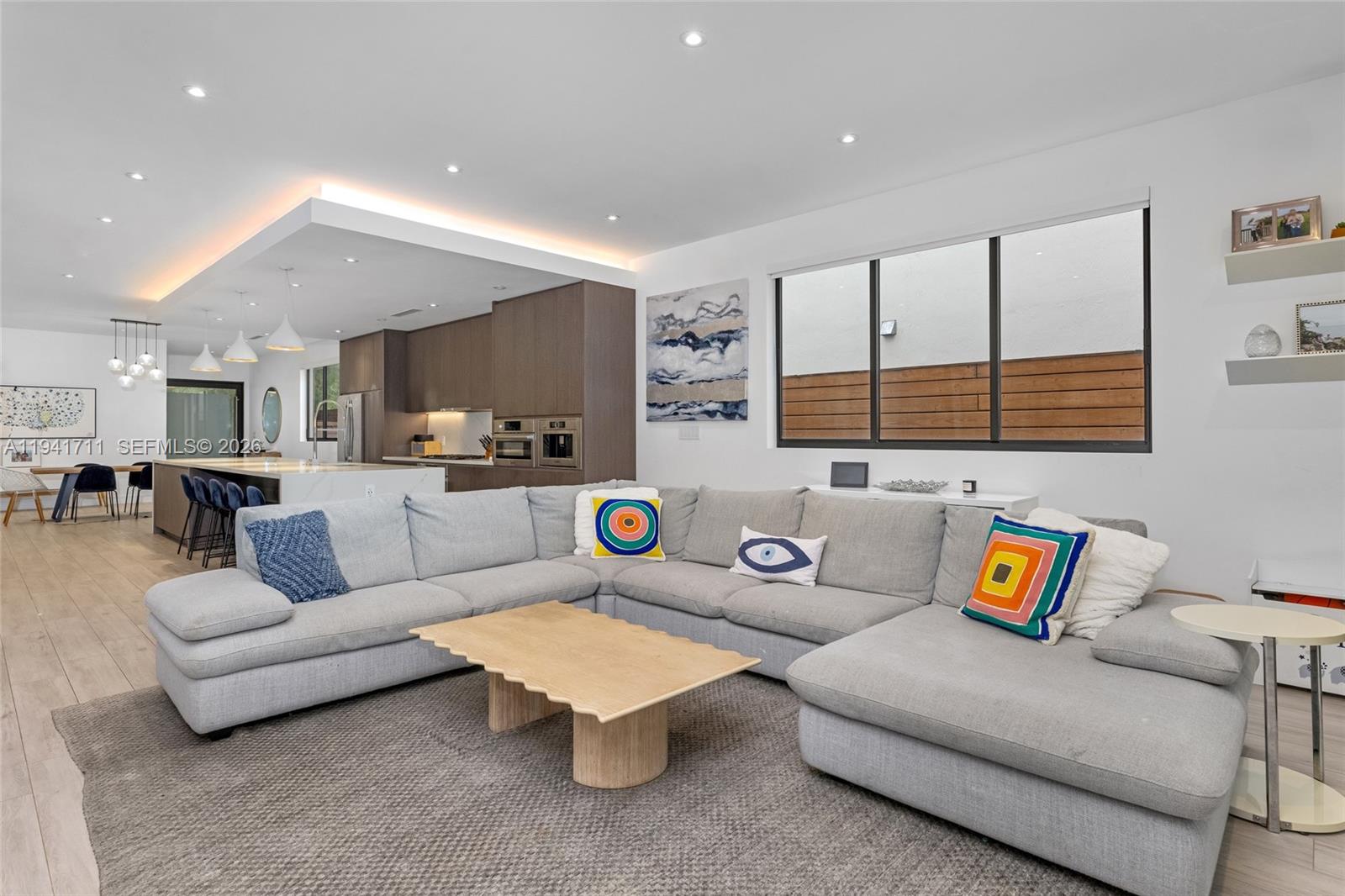 3222 Matilda Street, Unit 3222 Miami, FL 33133 - Photo 21 of 70 a living room with furniture and kitchen view