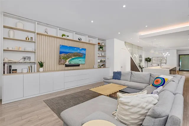 a view of a room with wooden floor